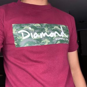 Size small, nice diamond maroon shirt!